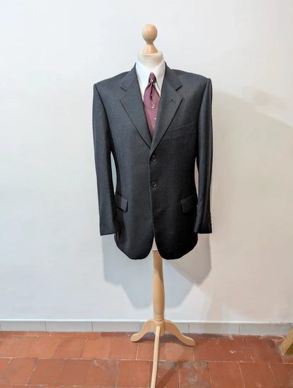 Heavy, evil, gray flannel suit