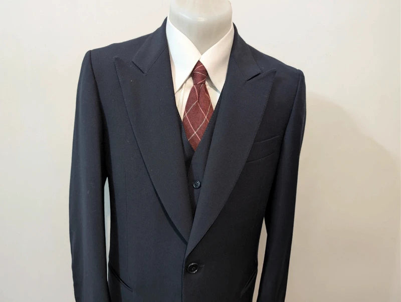 Exceptional navy blue three-piece wool suit
