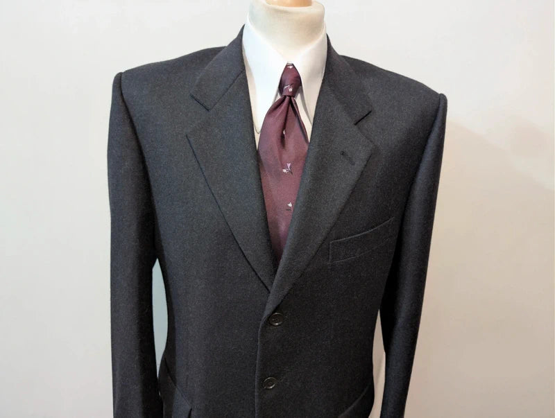 Heavy, evil, gray flannel suit