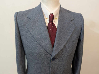 Gentille veste de couleur bleu à motif chevron en laine