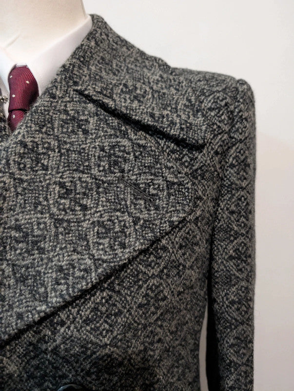 Étrange manteau en tweed