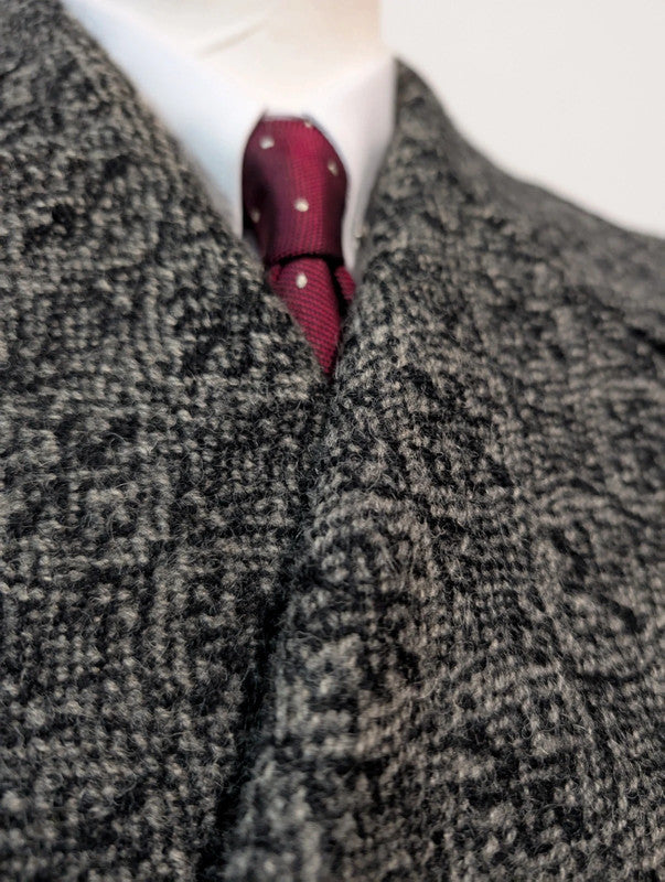 Étrange manteau en tweed