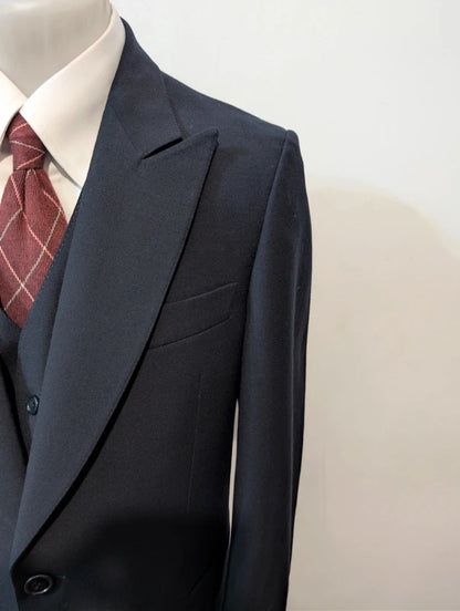 Exceptional navy blue three-piece wool suit