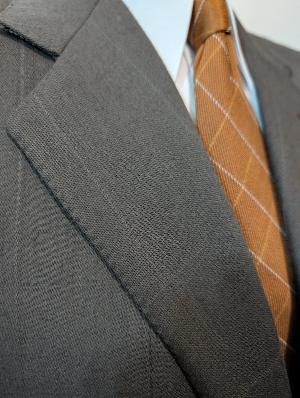 Elegante grüne karierte Wolljacke