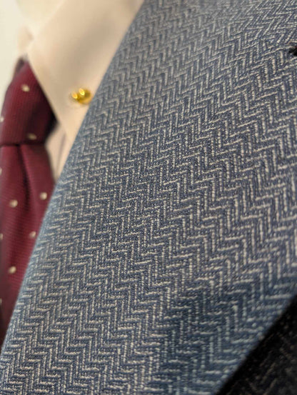 Gentille veste de couleur bleu à motif chevron en laine