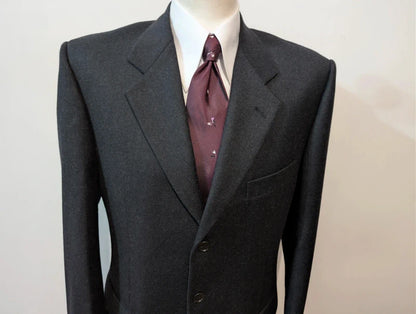 Heavy, evil, gray flannel suit