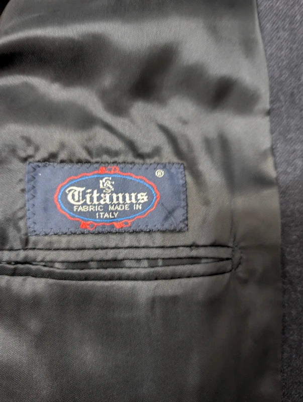 Heavy, evil, gray flannel suit