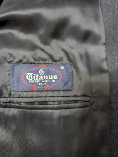 Heavy, evil, gray flannel suit